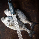 Microplane Gourmet Zester Grater Dark Grey with ergonomic handle and stainless steel fine blade for citrus, cheese, and spices