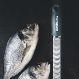 Microplane Gourmet Zester Grater Dark Grey with ergonomic handle and stainless steel fine blade for citrus, cheese, and spices