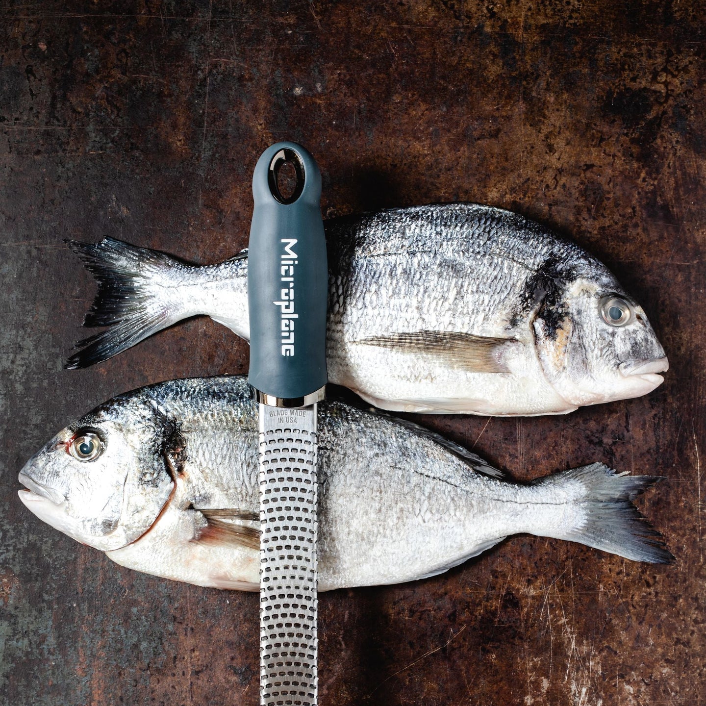 Microplane Gourmet Zester Grater Dark Grey with ergonomic handle and stainless steel fine blade for citrus, cheese, and spices