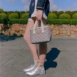 Kollab x Karen Walker Lunch Box Sage Monogram | Minimax - with a girl holding