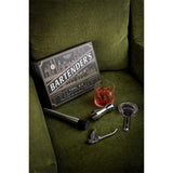 Gentlemen's Hardware Bartenders Kit - Bartender's tool kit with tools and a glass of cocktail on a green surface
