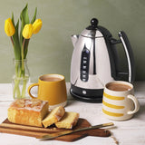 Dualit Lite Jug Kettle Black 1.5L | Minimax - in a table with bread and coffee