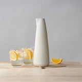 Mud Australia Water Jug Milk 1L | Minimax - with lemons in glass