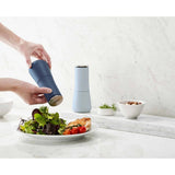 Joseph Joseph Milltop Salt & Pepper Mill Set Sky | Minimax - in a kitchen counter 