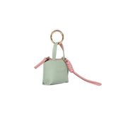 Louenhide Gina Bag Charm Sage Green shaped like a mini handbag with pink strap detail
