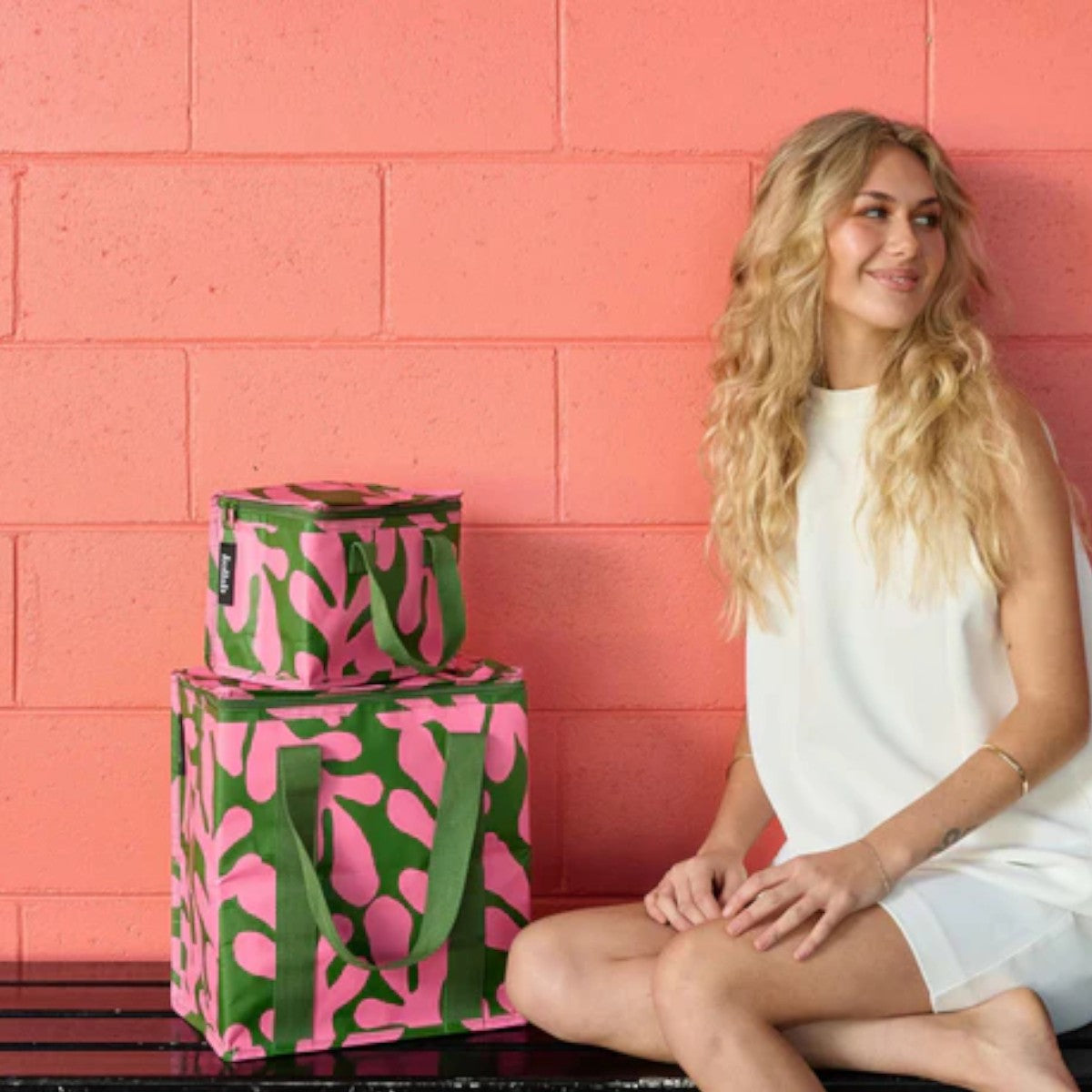 Kollab Cooler Bag Coral Canopy | Minimax - with a woman sitting beside