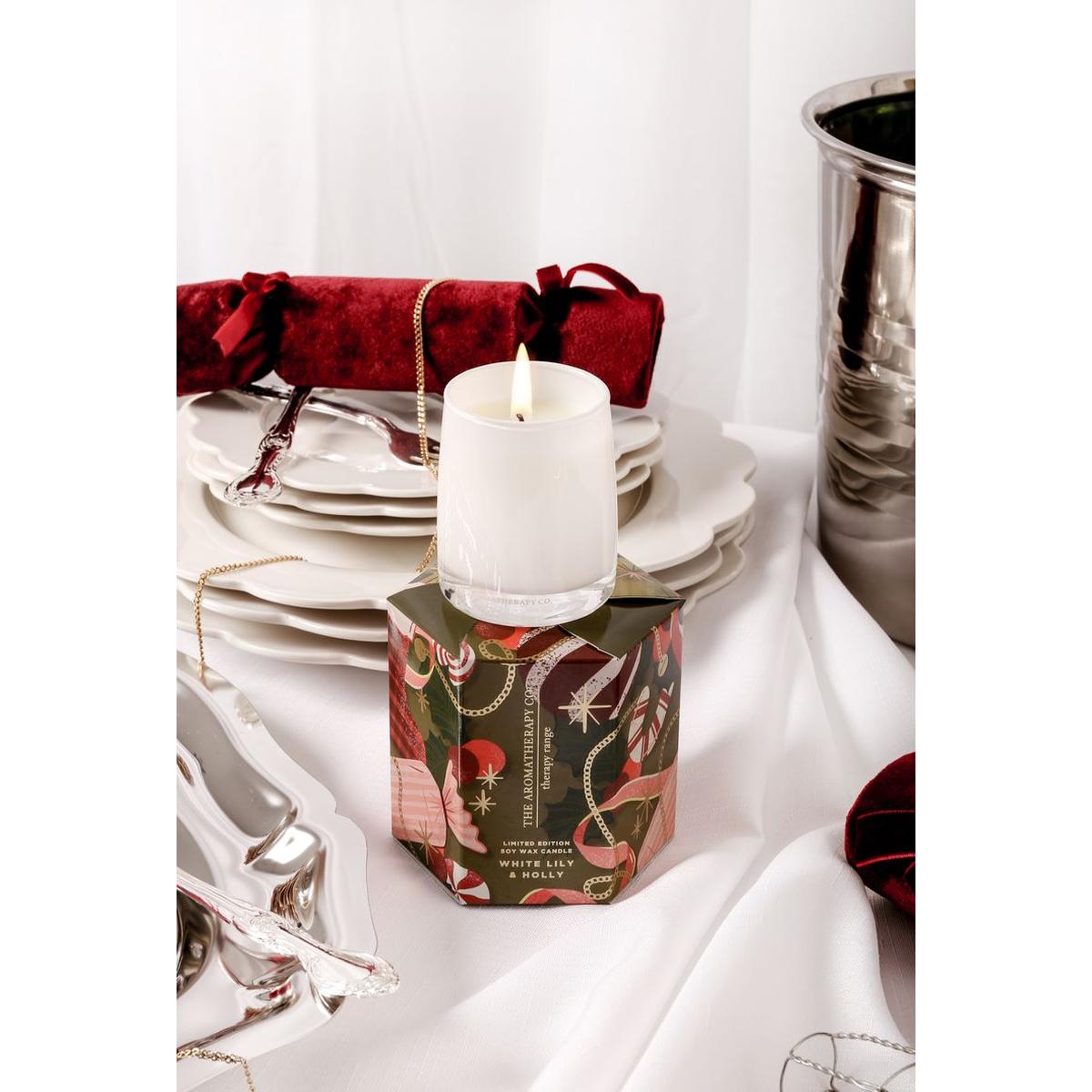 The Aromatherapy Co. White Lily & Holly Candle 80g – festive soy wax candle in white glass jar with seasonal green and red gift box