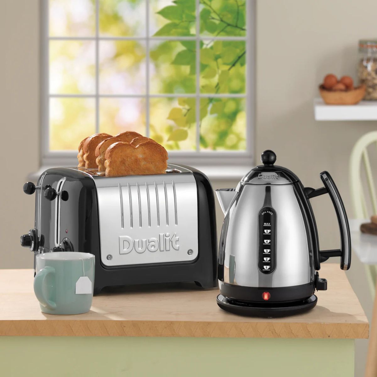 Dualit Lite Jug Kettle Black 1.5L | Minimax - in a table with a toaster