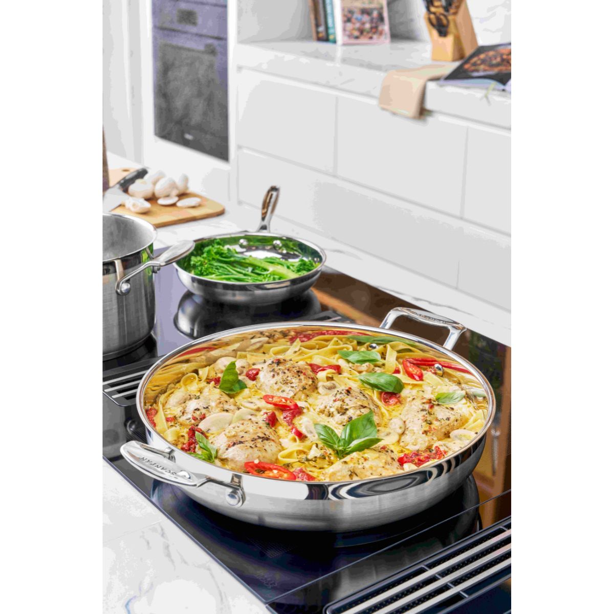 Scanpan Impact Chef's Pan and Frypan Set 28cm | Minimax - in the kitchen with pasta and vegetables