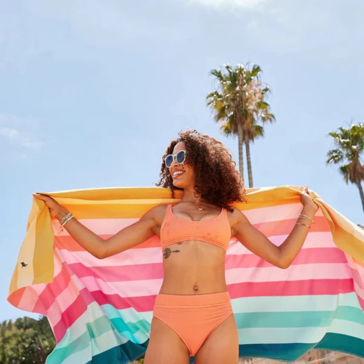 Dock & Bay Summer Collection Beach Towel Coastal Candy 90x160cm | Minimax - with a woman on a beach