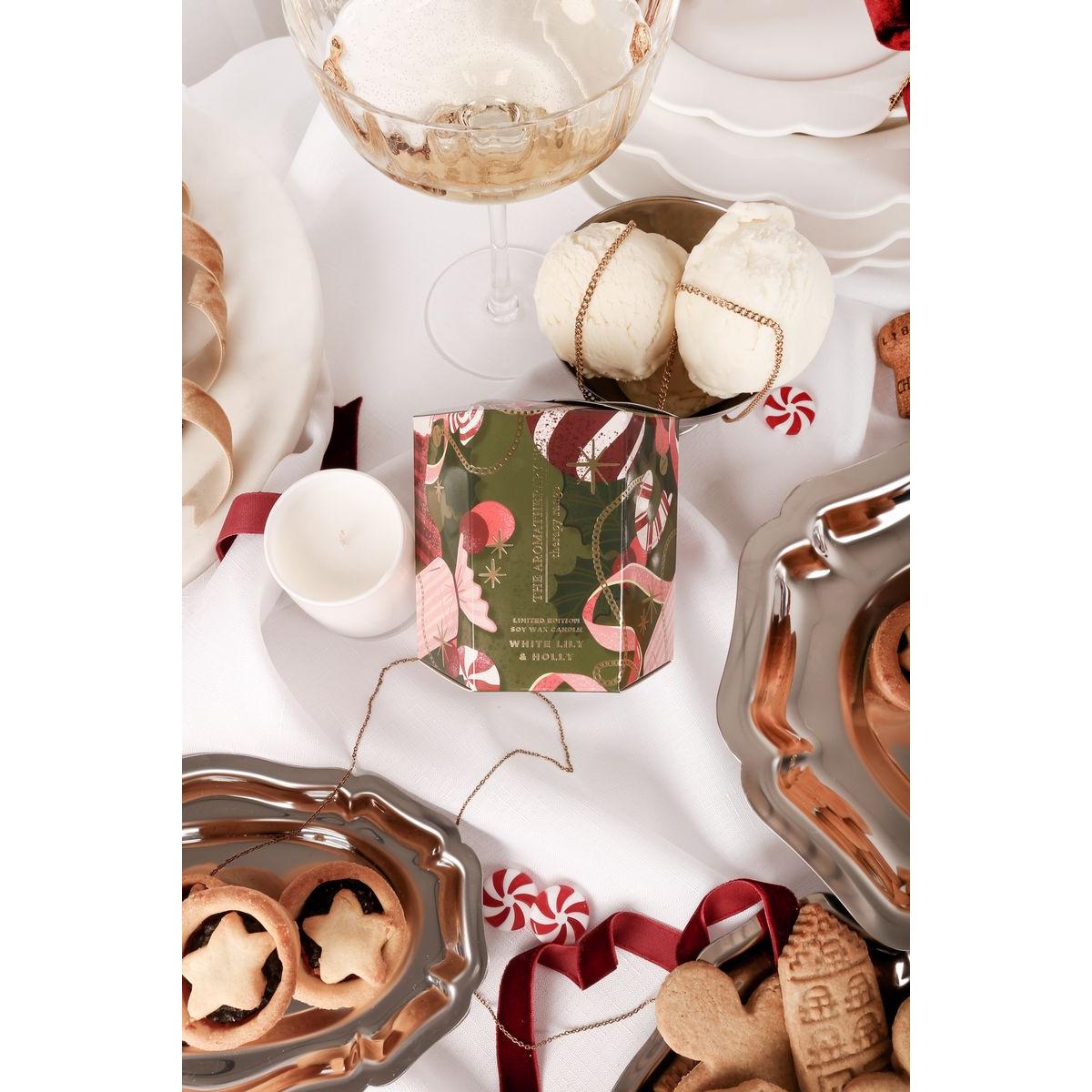 The Aromatherapy Co. White Lily & Holly Candle 80g – festive soy wax candle in white glass jar with seasonal green and red gift box