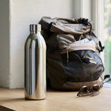 Aarke Stainless Steel Insulated Bottle 1L | Minimax - with a bag and sunglass