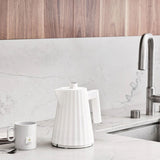 Alessi Plissé 1L electric kettle in white with pleated design and modern sculptural shape