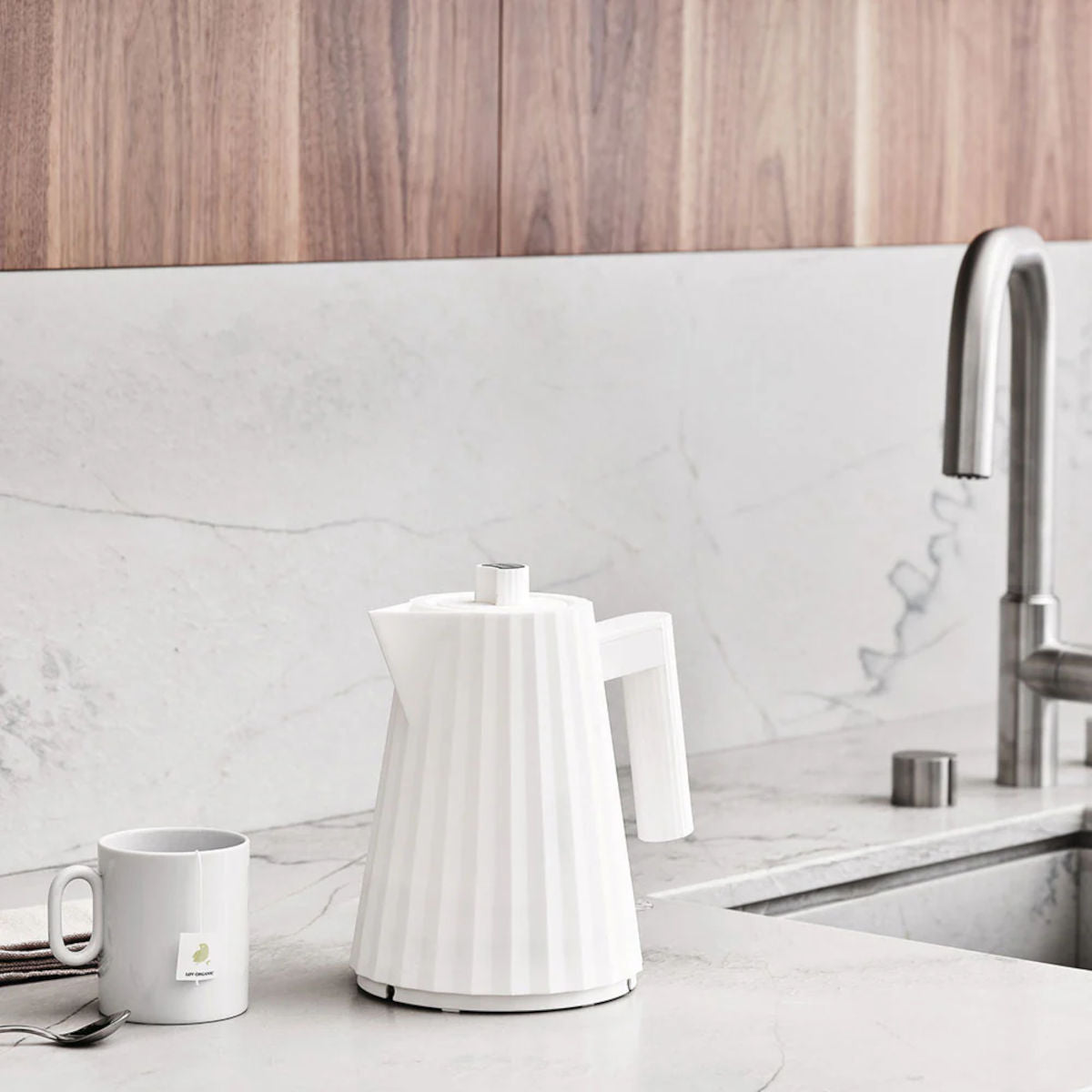 Alessi Plissé 1L electric kettle in white with pleated design and modern sculptural shape