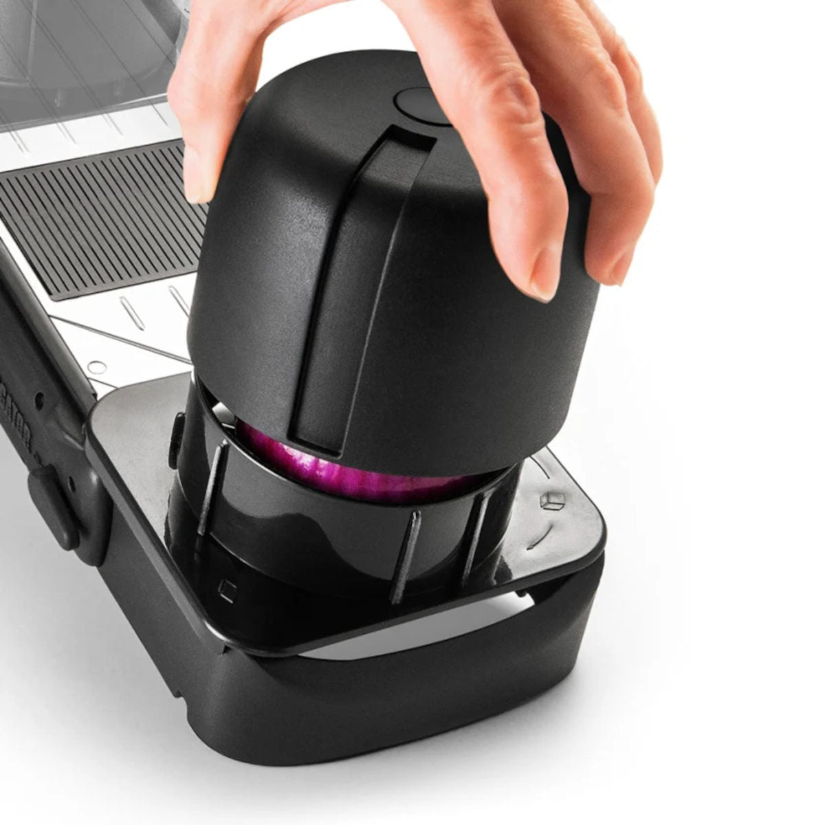 Alligator Mandoline Slicer Black, angled view with onion in holder showing slicing function on white background