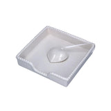 Ceramic Heart Napkin Holder White displayed with blue patterned napkins on wooden table