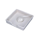 Ceramic Heart Napkin Holder White displayed with blue patterned napkins on wooden table