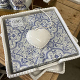 Ceramic Heart Napkin Holder White displayed with blue patterned napkins on wooden table
