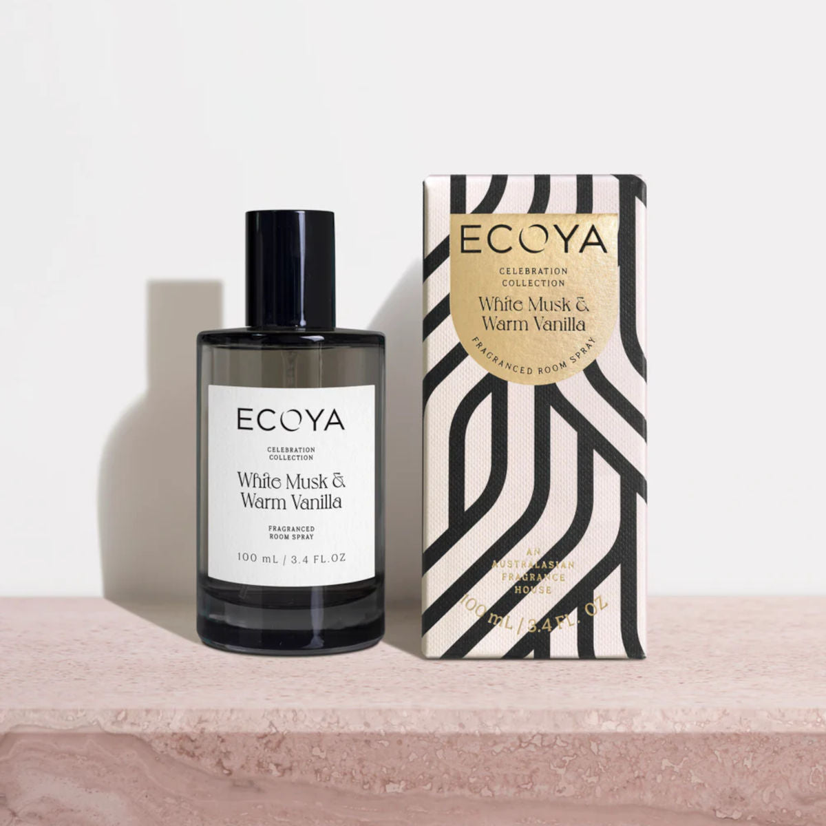 Ecoya Celebration Collection White Musk & Warm Vanilla Room Spray 100mL displayed with its premium gift box on a stone surface.