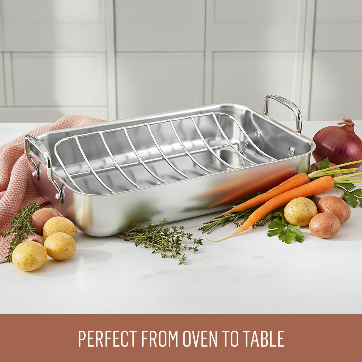Essteele Stainless Steel Roaster with Rack surrounded by fresh vegetables on counter