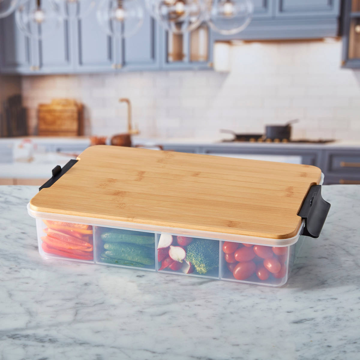 Farberware SnackleBox with Bamboo Board 30 x 40cm - Bamboo lid on a container with compartments filled with vegetables in a kitchen setting
