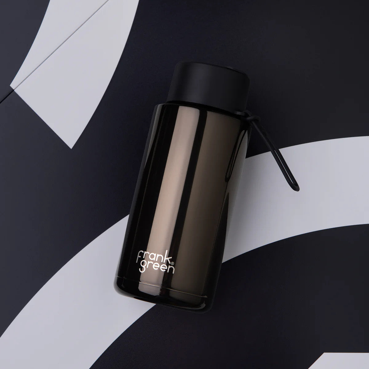 Frank Green Ceramic Reusable Bottle Shadow Chrome 1L – top view on patterned background