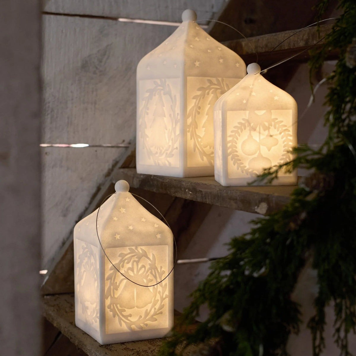 French Country LED Bauble Lantern – glowing white lanterns displayed on rustic steps