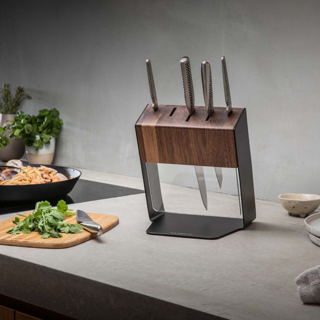 Global Katana knife block set on kitchen bench, walnut block with stainless steel knives in modern kitchen setting