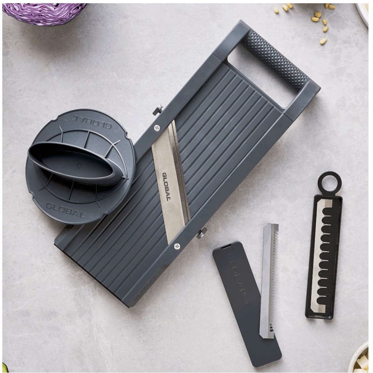 Global Mandoline Slicer 9.5cm – professional-grade kitchen slicer with stainless steel blades and interchangeable cutting inserts.