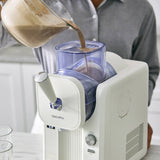GreenPan Frost Ice-Cream & Slushie Maker Cream – lifestyle image with person pouring chocolate mix into top container