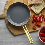 GreenPan Stanley Tucci Stainless Steel Frypan Set 20cm & 26cm with gold handles stacked together on white background