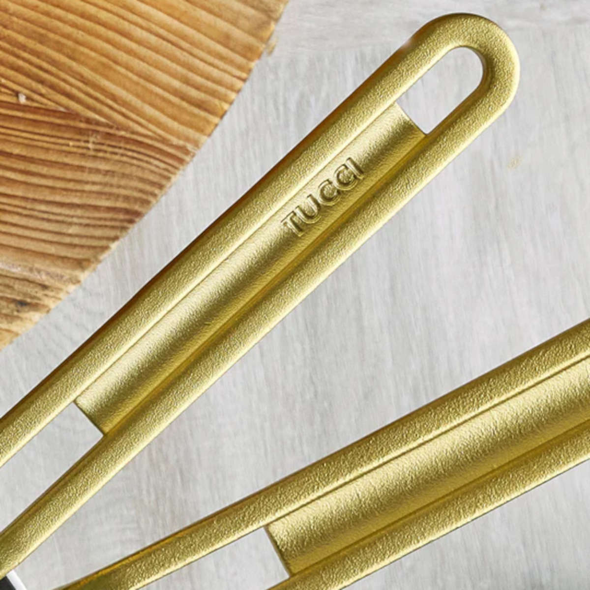 GreenPan Stanley Tucci Stainless Steel Frypan Set 20cm & 26cm with gold handles stacked together on white background