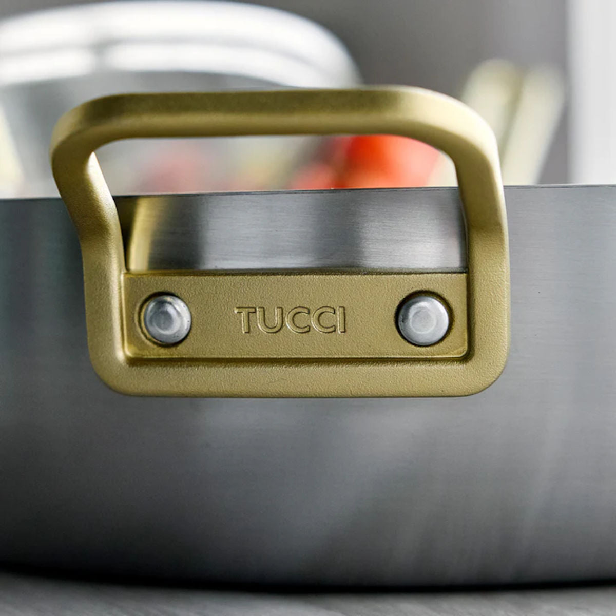 GreenPan Stanley Tucci Stainless Steel Stanley Pan 33cm (6.2L) with glass lid and gold handles on white background