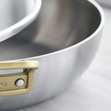 GreenPan Stanley Tucci Stainless Steel Stanley Pan 33cm (6.2L) with glass lid and gold handles on white background