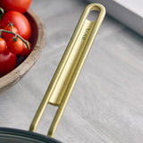 GreenPan Stanley Tucci Stainless Steel Stanley Pan 33cm (6.2L) with glass lid and gold handles on white background