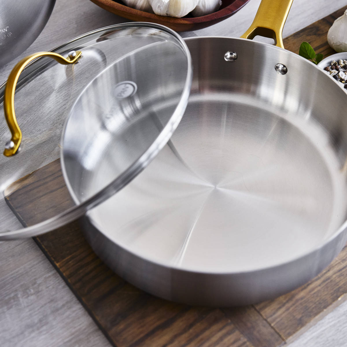 GreenPan Padova Stainless Steel Sauté Pan 24cm – top view with lid resting to the side