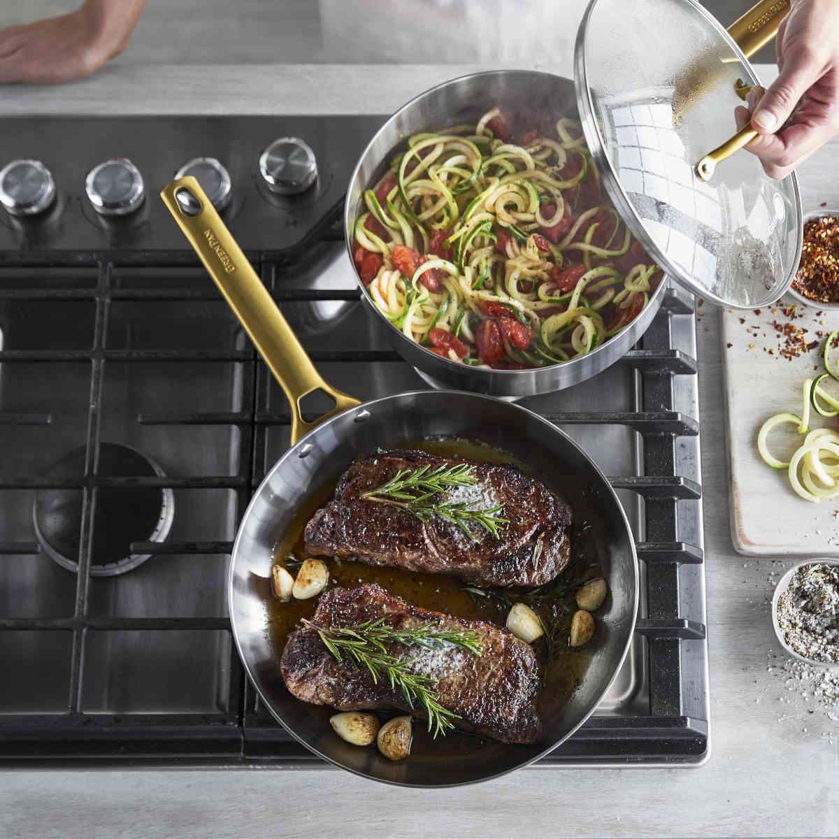 GreenPan Padova Stainless Steel Sauté Pan 24cm – shown on stove with food inside