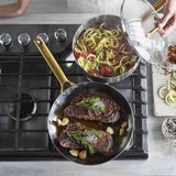 GreenPan Padova Stainless Steel Sauté Pan 24cm – shown on stove with food inside