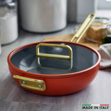 GreenPan Stanley Tucci Pan Junior Orange – lifestyle kitchen view with “Made in Italy” badge