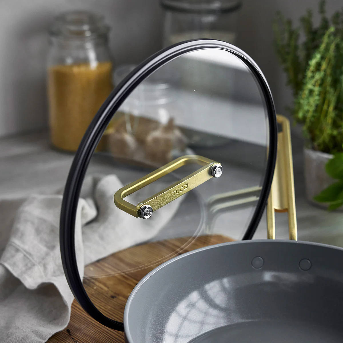 GreenPan Stanley Tucci Pan Junior Oxford Blue – glass lid handle close-up in kitchen