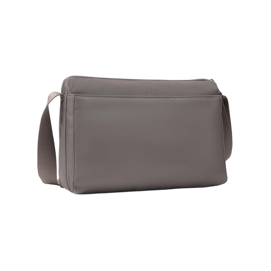 Rear view of the Hedgren Inner City Eye Neo Crossbody in Sepia, featuring a clean, minimalist back panel and adjustable shoulder strap.