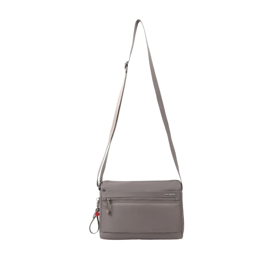 Hedgren Inner City Eye Neo Crossbody Bag in Sepia, shown front-on with an adjustable shoulder strap and dual front zip compartments.