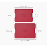 Joseph Joseph Cut & Carve Plus Multi-function Chopping Board Red XL with angled cutting surface, spikes, and juice-catching edges