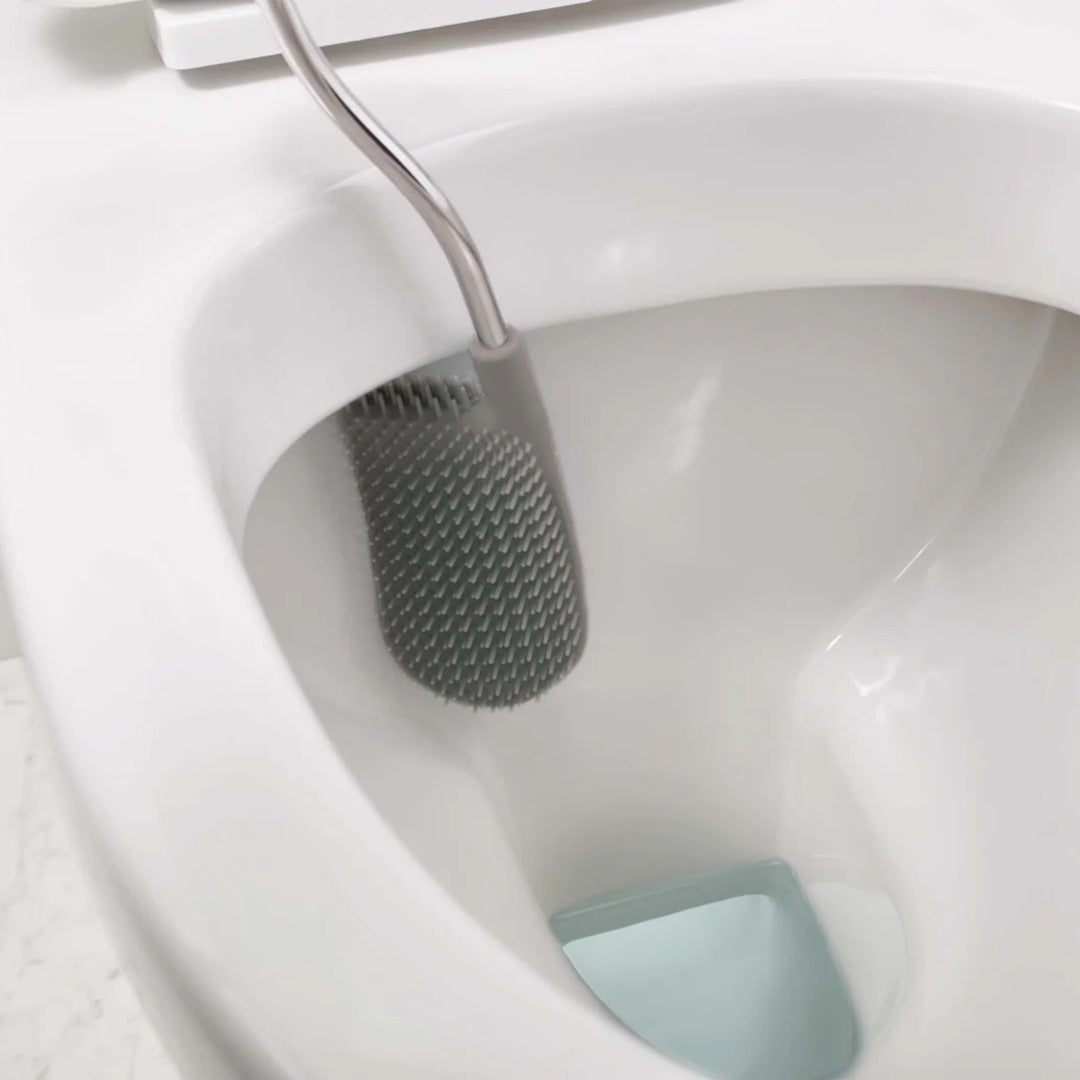 Flexible D-shaped head reaches under the rim for thorough cleaning