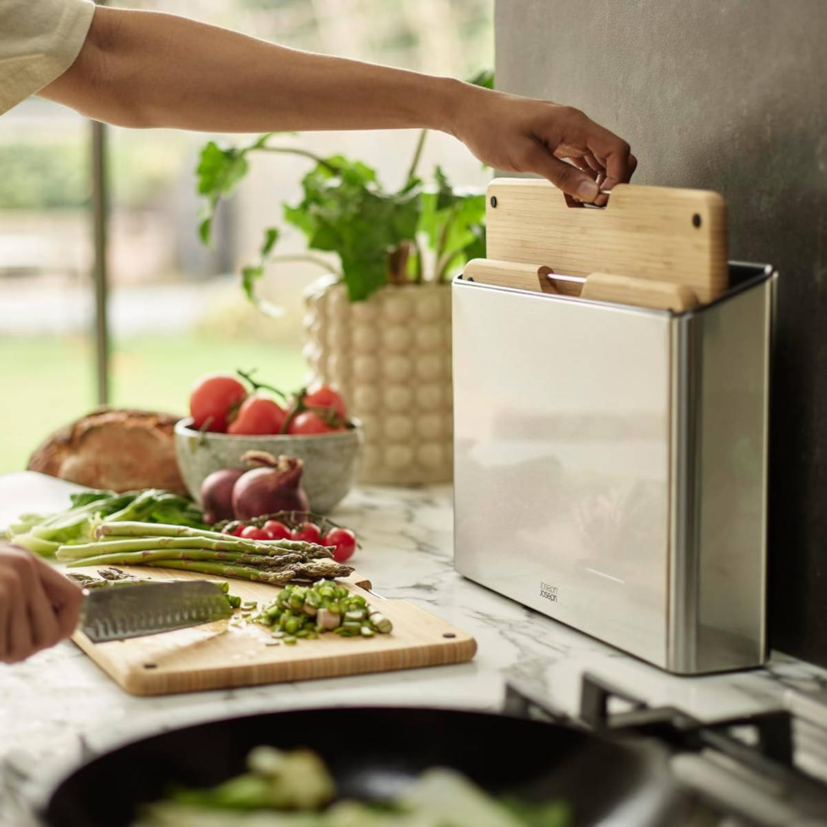 Joseph Joseph Folio bamboo boards stored in sleek stainless steel case on countertop
