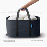 Close-up of basket filled with towels highlighting durable fabric and handles