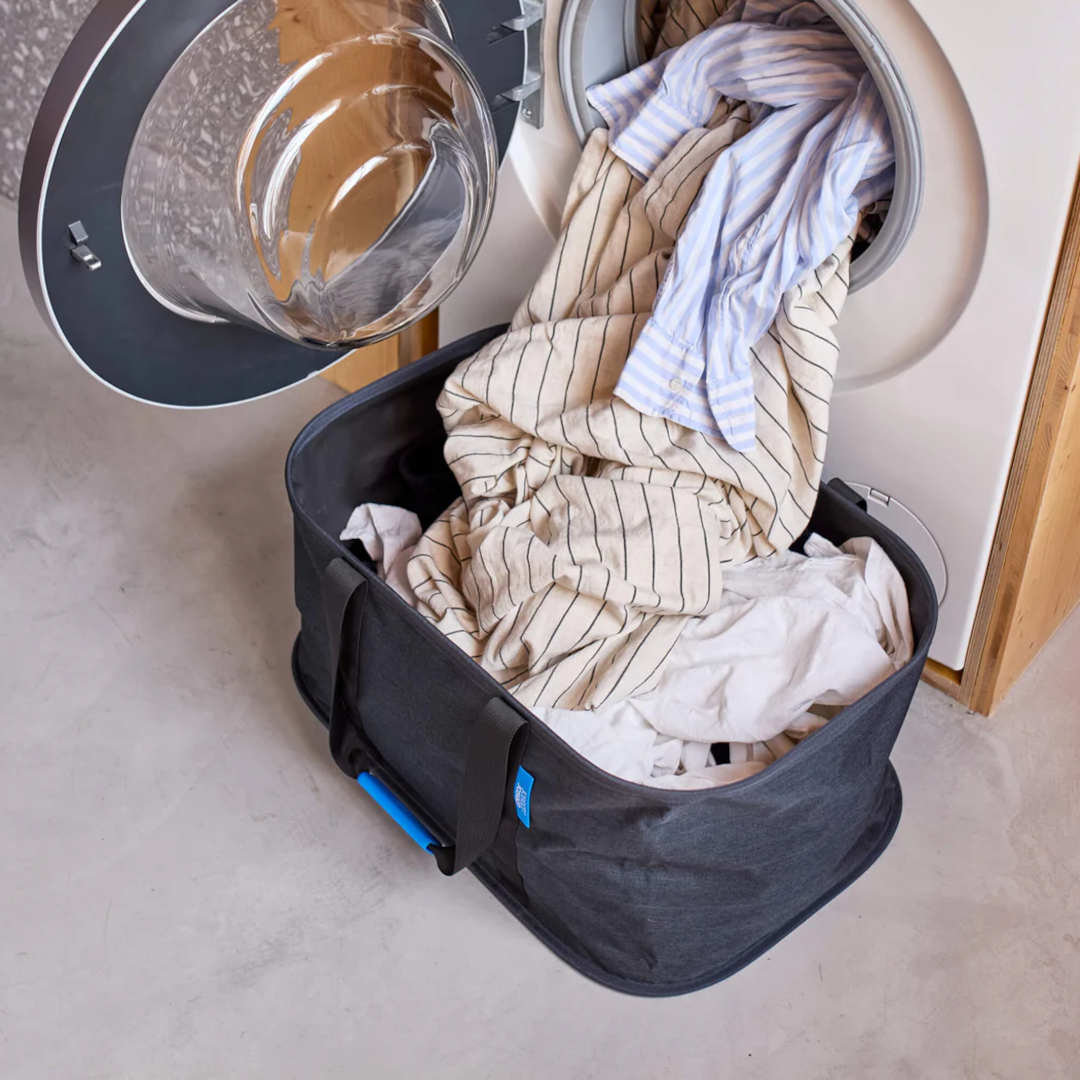 Loading laundry directly into the basket from the washing machine