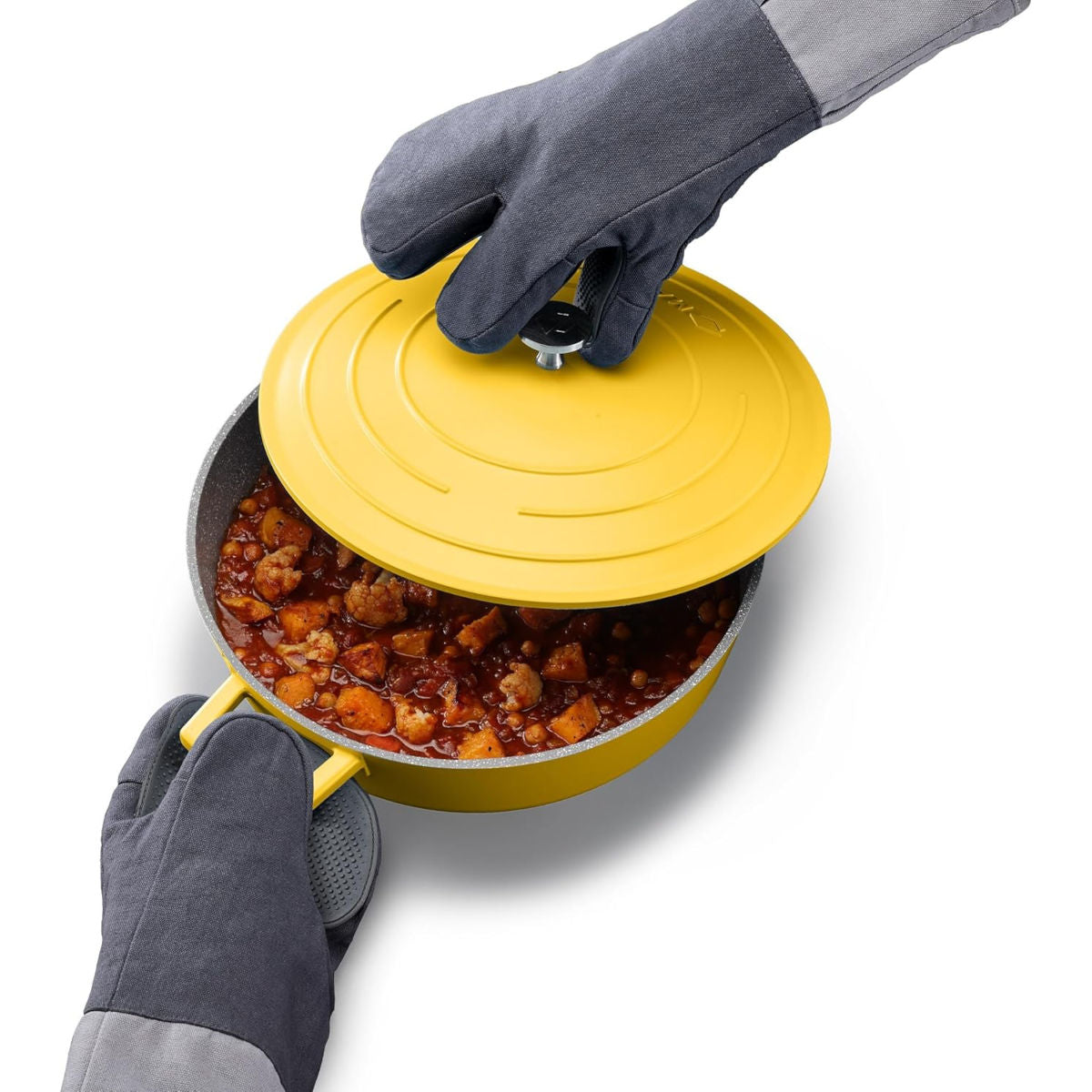 Joseph Joseph Pinch gloves lifting lid of yellow pot filled with stew