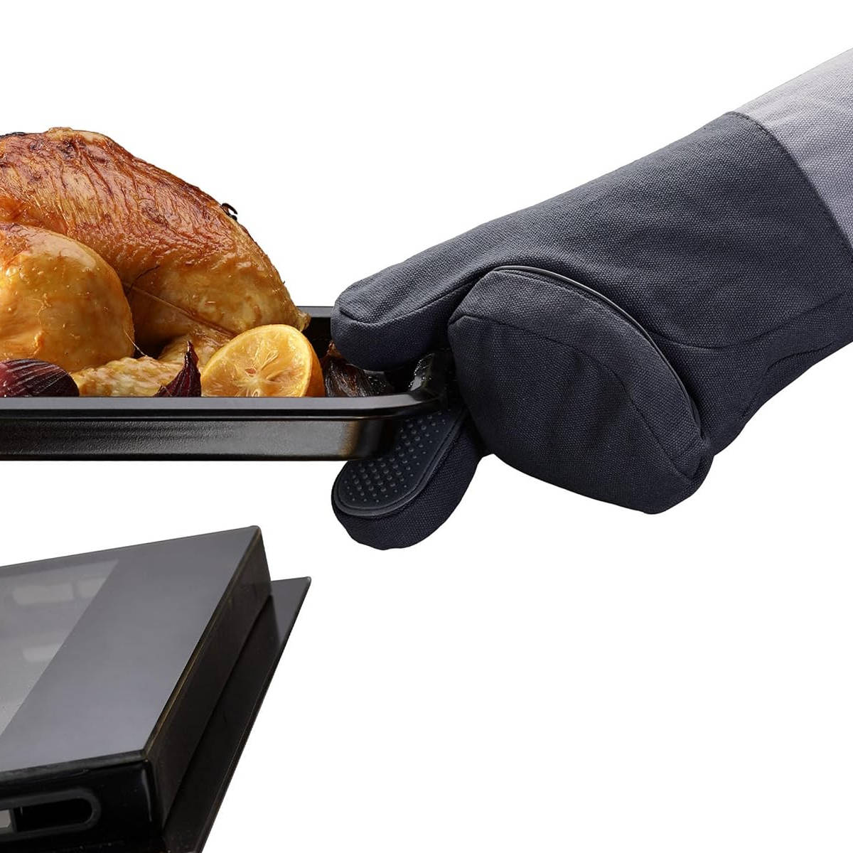 Joseph Joseph Pinch oven glove holding tray with roasted chicken and lemon