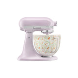 KitchenAid Artisan tilt-head stand mixer in pastel purple with wildflower patterned bowl